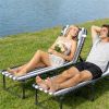 2 folding outdoor lounge chairs, blue and white